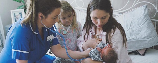 Nurse with young child, mother and baby