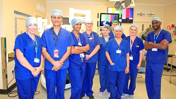 Theatre team and surgical robot